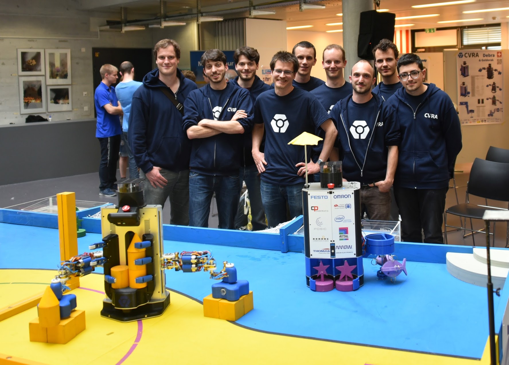 CVRA team members along with Debra and Goldorak at SwissEurobot 2016